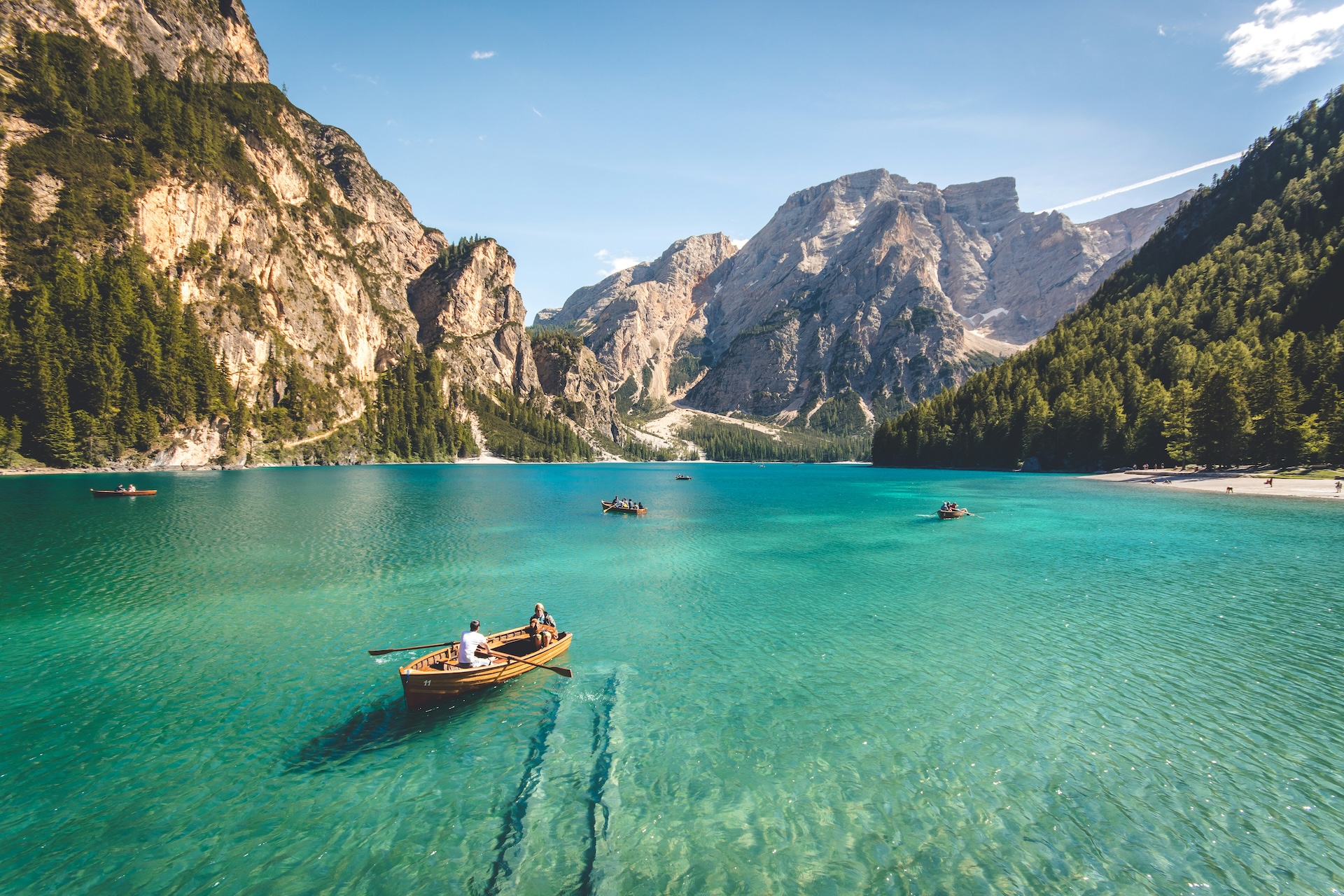 people on a boat in mountain lake